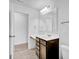 Bright bathroom with modern vanity, mirror and tiled floor at 5374 Marigold Dr, Plainfield, IN 46168