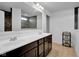 Bathroom with double sink vanity and large mirror, complemented by stylish lighting at 5374 Marigold Dr, Plainfield, IN 46168