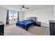 Spacious bedroom featuring carpet, a ceiling fan, and a large window for natural light at 5374 Marigold Dr, Plainfield, IN 46168
