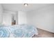 Bedroom featuring neutral carpet and a bed with a floral patterned comforter at 5374 Marigold Dr, Plainfield, IN 46168