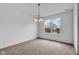 Bright dining room with neutral carpet, white walls, and a classic chandelier at 5374 Marigold Dr, Plainfield, IN 46168