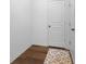 Hallway with wood-style flooring and a decorative rug at 5374 Marigold Dr, Plainfield, IN 46168