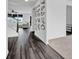 Stylish hallway features dark wood floors, white walls and trim, and an open staircase at 5374 Marigold Dr, Plainfield, IN 46168