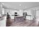 Bright kitchen featuring white cabinets, an island, and stainless steel appliances at 5374 Marigold Dr, Plainfield, IN 46168
