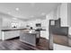 Well-lit kitchen with granite counters, white cabinets, and modern appliances at 5374 Marigold Dr, Plainfield, IN 46168