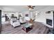 Spacious living room with dark floors that leads to an open kitchen and staircase at 5374 Marigold Dr, Plainfield, IN 46168