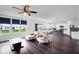 Open concept living space with dark floors, that leads to a modern kitchen at 5374 Marigold Dr, Plainfield, IN 46168