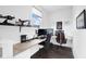 Home office with a built-in desk, comfortable chairs, and natural light at 5374 Marigold Dr, Plainfield, IN 46168