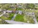 Aerial view of a landscaped front yard and a long driveway leading to a brick home at 5420 E 81St St, Indianapolis, IN 46250
