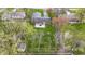 Aerial view of a brick home featuring a patio and spacious yard at 5420 E 81St St, Indianapolis, IN 46250