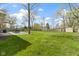 Large backyard with green lawn, mature trees, and storage shed at 5420 E 81St St, Indianapolis, IN 46250