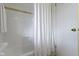 Clean and bright bathroom with white subway tiles, a bathtub, and a shower curtain for a fresh and modern look at 5420 E 81St St, Indianapolis, IN 46250