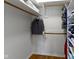 Well-organized walk-in closet featuring ample shelving, hanging rods, and hardwood floors at 5420 E 81St St, Indianapolis, IN 46250
