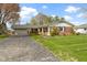Charming brick home with a well-maintained lawn and attached two-car garage at 5420 E 81St St, Indianapolis, IN 46250