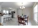 Eat-in kitchen features a breakfast bar with seating, stainless appliances, and tile flooring at 5420 E 81St St, Indianapolis, IN 46250