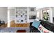 Inviting living area showcasing a fireplace with built-ins, hardwood floors and natural light at 5420 E 81St St, Indianapolis, IN 46250