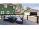 Relax on this deck with an outdoor seating area with a fire pit table and attached two-car garage at 564 N Beville Ave, Indianapolis, IN 46201