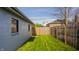 Private fenced backyard is newly landscaped with fresh sod at 564 N Beville Ave, Indianapolis, IN 46201