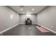 Unfinished basement area featuring a desk area, concrete floor, and workout mat at 564 N Beville Ave, Indianapolis, IN 46201