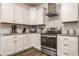 Well-equipped kitchen with modern appliances, white cabinets, and granite countertops at 564 N Beville Ave, Indianapolis, IN 46201