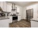 Modern kitchen featuring white cabinets, stainless steel appliances, and stylish countertops at 564 N Beville Ave, Indianapolis, IN 46201