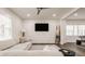 Spacious living room with a cozy sectional sofa, entertainment area, and ample natural light at 564 N Beville Ave, Indianapolis, IN 46201