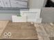 Sample of the home's interior finishes including cabinets, countertops, and flooring at 5721 Palazzo Ln, McCordsville, IN 46055