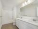 Bathroom featuring double sinks, white cabinets, and a shower-tub combination at 5804 Summertree Pl, Whitestown, IN 46052