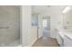 Bathroom featuring a tiled shower, modern vanity, and a bright open layout at 5804 Summertree Pl, Whitestown, IN 46052