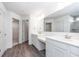 Modern bathroom with dual vanities, quartz countertops, and a large mirror for a luxurious feel at 5804 Summertree Pl, Whitestown, IN 46052