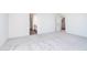 Spacious bedroom with neutral carpet and adjacent bathrooms for added convenience at 5804 Summertree Pl, Whitestown, IN 46052