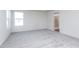 This is a bedroom featuring neutral carpet and an ensuite bathroom with a walk-in shower at 5804 Summertree Pl, Whitestown, IN 46052