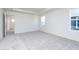 Bright bedroom with neutral carpet, white walls, and plenty of natural light from the windows at 5804 Summertree Pl, Whitestown, IN 46052