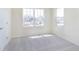 Bright bedroom with plush carpeting and large windows offering neighborhood views at 5804 Summertree Pl, Whitestown, IN 46052