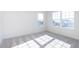 Sunlit bedroom showcasing large windows and neutral colored carpet at 5804 Summertree Pl, Whitestown, IN 46052