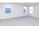 Bedroom featuring plush carpet, multiple windows providing natural light, and neutral walls at 5804 Summertree Pl, Whitestown, IN 46052