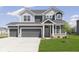Charming two-story home featuring a two-car garage and beautiful landscaping with a well-manicured lawn at 5804 Summertree Pl, Whitestown, IN 46052
