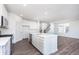 Modern kitchen featuring white cabinets, stainless steel appliances, and a large island at 5804 Summertree Pl, Whitestown, IN 46052