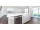 Modern kitchen featuring white cabinets, an island with a sink and stainless steel appliances at 5804 Summertree Pl, Whitestown, IN 46052