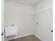Functional laundry room with utility sink and shelving, plus vinyl floors at 5804 Summertree Pl, Whitestown, IN 46052