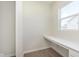 Bright office nook features a long countertop, a large window, and wood-look flooring at 5804 Summertree Pl, Whitestown, IN 46052