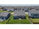 Aerial view showcasing the home's backyard, fencing, and neighborhood at 6472 W Treeline Ln, McCordsville, IN 46055