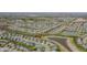 Expansive aerial view of a community, highlighting homes near serene ponds and green spaces at 6472 W Treeline Ln, McCordsville, IN 46055