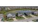 Aerial shot of homes with manicured lawns, a small pond and view of the neighborhood at 6472 W Treeline Ln, McCordsville, IN 46055