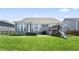 Backyard features a play structure, and a home exterior with large windows at 6472 W Treeline Ln, McCordsville, IN 46055