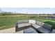 Backyard patio and furniture with a view of a pond at 6472 W Treeline Ln, McCordsville, IN 46055