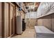Unfinished basement with utilities, water heater, and washer and dryer at 6472 W Treeline Ln, McCordsville, IN 46055