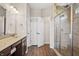 Bathroom with a glass-enclosed shower, vanity with sink, and tiled floors at 6472 W Treeline Ln, McCordsville, IN 46055