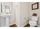 Charming half-bath with a pedestal sink, modern fixtures, and stylish decor at 6472 W Treeline Ln, McCordsville, IN 46055
