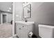 Bathroom with vanity sink, modern fixtures, neutral walls, and tile flooring at 6472 W Treeline Ln, McCordsville, IN 46055